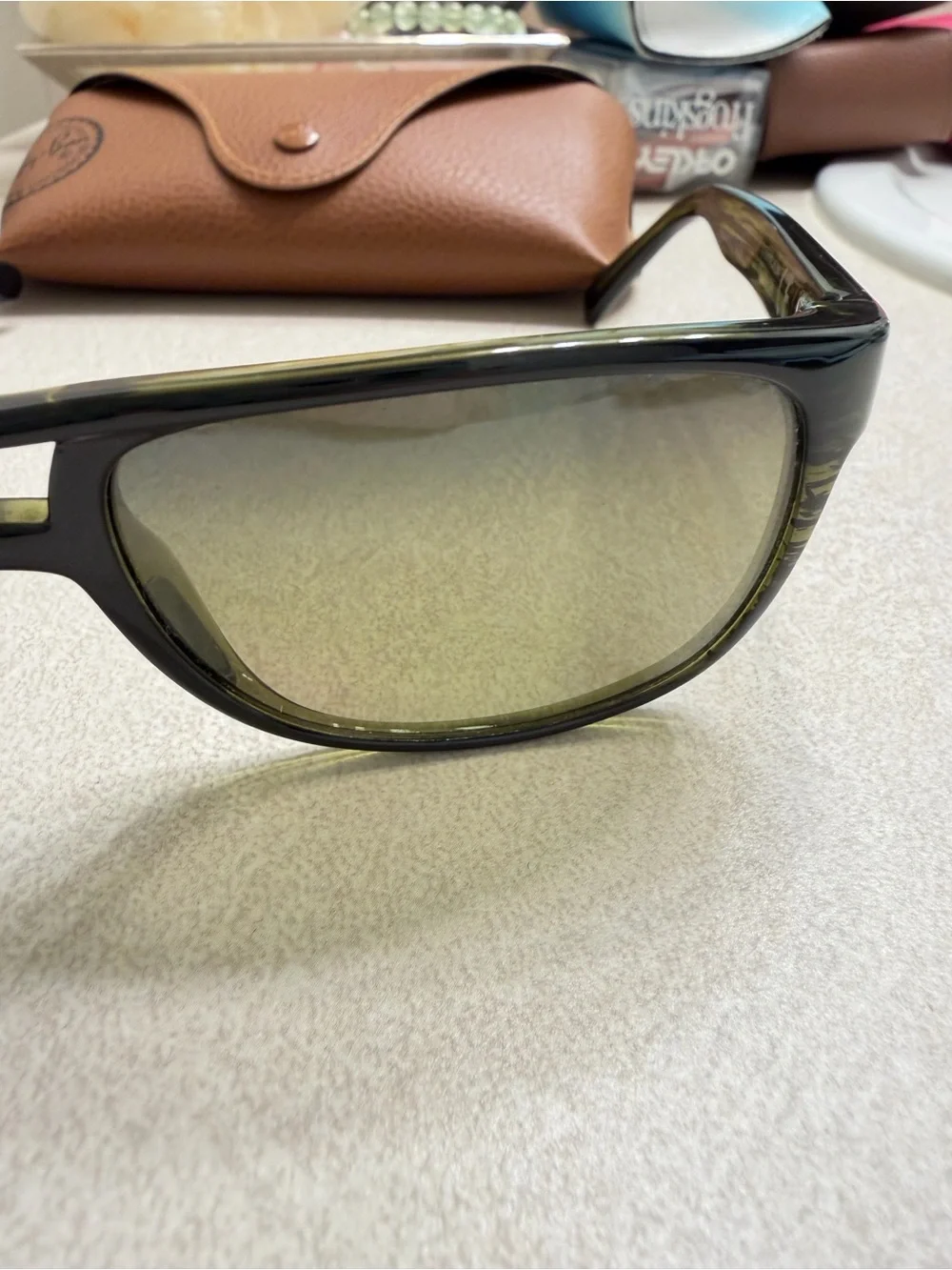 Maui Jim Black Frame Sunglasses with Green-Tinted Lenses